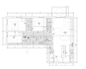 A detailed architectural floor plan of a building with various rooms and measurements.