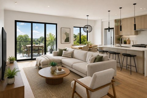 A modern living room with a large white sofa, a wooden coffee table, and a flat-screen TV.