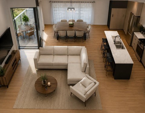 A modern living room with a white sofa and a coffee table.