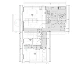 A detailed architectural floor plan of a building with labeled rooms and measurements.