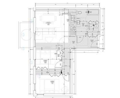 A detailed architectural floor plan of a building with labeled rooms and measurements.