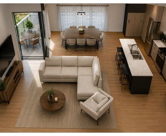 A modern living room with a white sofa and a coffee table.