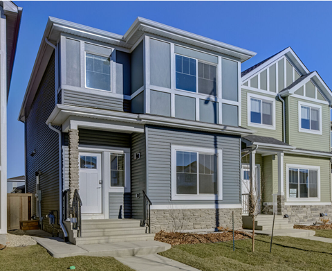 A modern two-story house with a front porch and a white door.