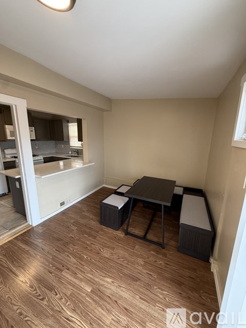 A room with a table and chairs in it.