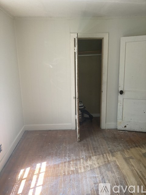 A room with a door open to another room.
