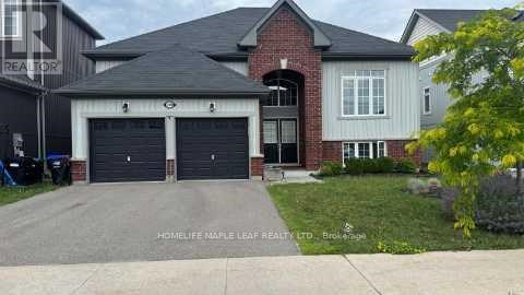 A two-story house with a garage is for sale.