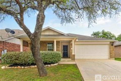 A house with a tree in front of it.