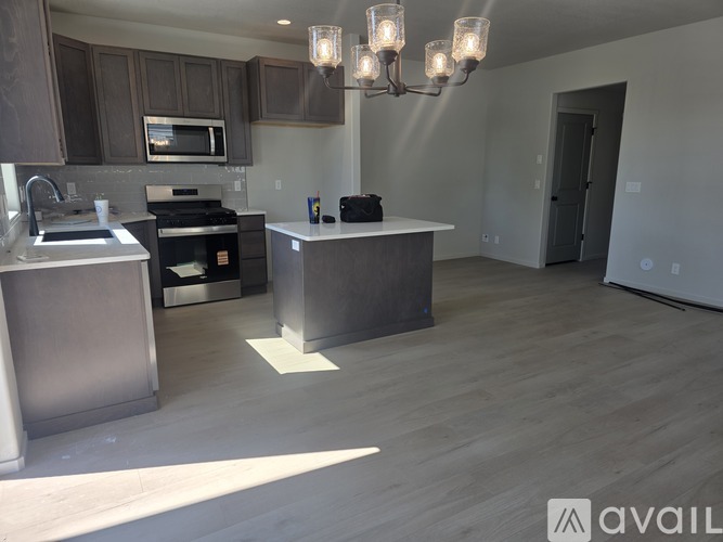 A modern kitchen with a large island in the middle.