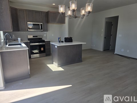 A modern kitchen with a large island in the middle.