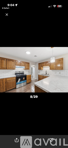 A kitchen with wooden cabinets and a white countertop.