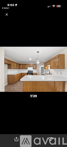 A kitchen with wooden cabinets and a white countertop.