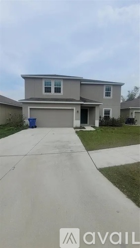 A house with a driveway in front of it.