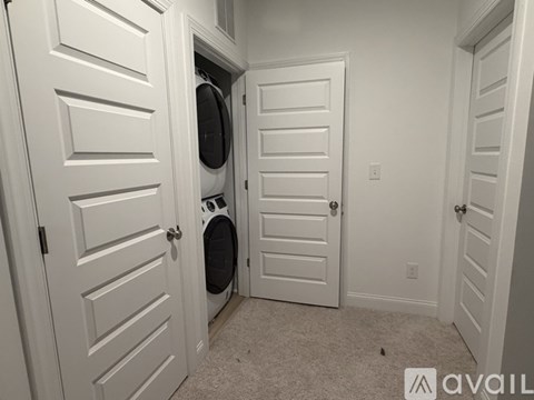 A laundry room with a washer and dryer in it.