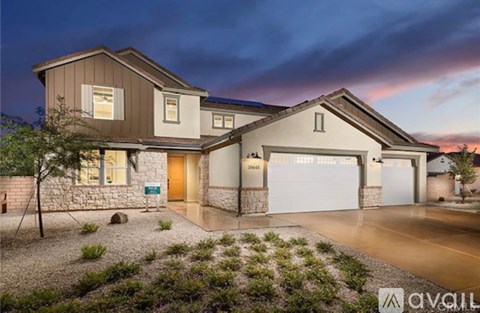 A modern house with a garage and a driveway.
