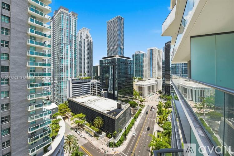 A cityscape with tall buildings and a clear sky.