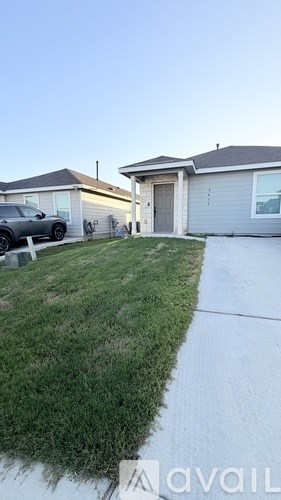 A house with a car parked in front of it.