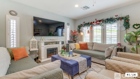 A living room with a fireplace and a couch.