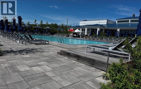 A pool area with a sign that says REALTOR.