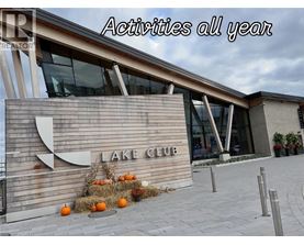 A sign that says Lake Club in front of a building.