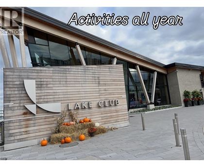 A sign that says Lake Club in front of a building.