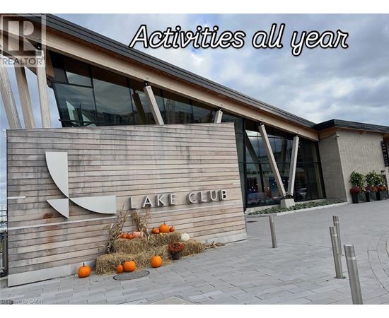 A sign that says Lake Club in front of a building.