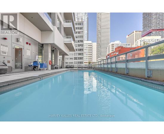 A swimming pool in a building with a sign that says "REALTOR".