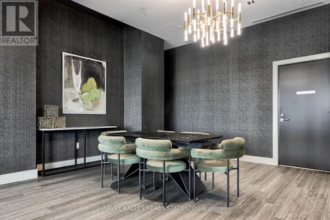 A dining room with a table set for six.