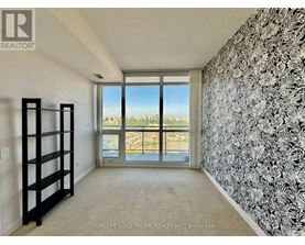 A room with a view of the city through the window.