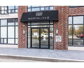 The front of a building with a sign that says "NORTHLINK II".