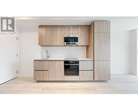 A modern kitchen with wooden cabinets and appliances.
