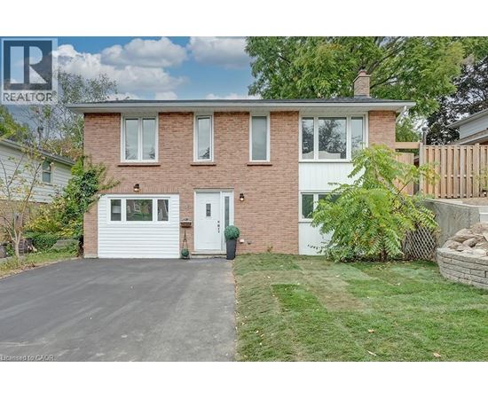 A house with a white garage door is for sale.