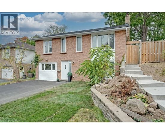 A house with a white door and a small front yard.