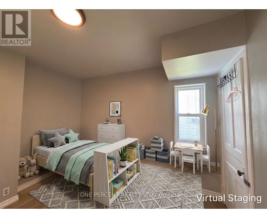 A bedroom with a bed, nightstand, and chair.