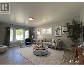 A living room with a couch, chair, and coffee table.