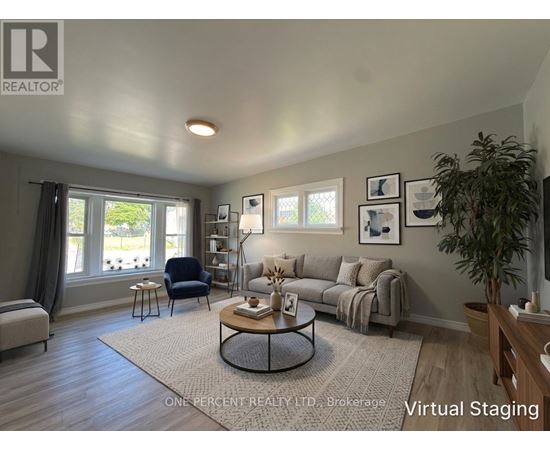 A living room with a couch, chair, and coffee table.