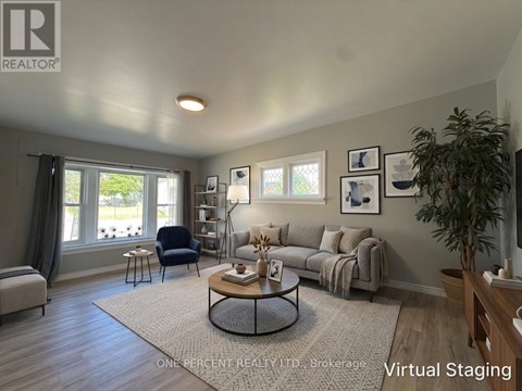 A living room with a couch, chair, and coffee table.