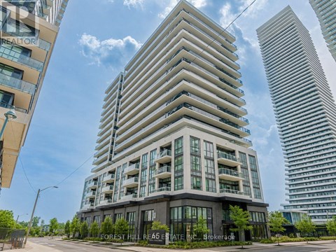 A tall building with the words "FOREST HILL REACH" on the front.