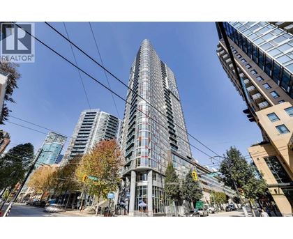 A tall building with many windows is in the center of the image.