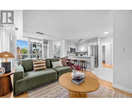 A living room with a green couch and a coffee table.