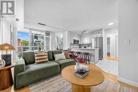 A living room with a green couch and a coffee table.
