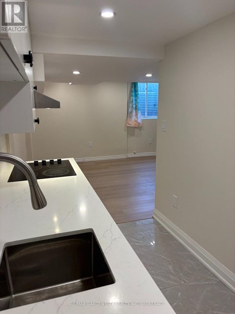 A kitchen with a sink and a window.