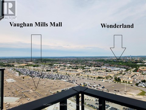 A picture of a Vaughan Mills Mall parking lot with a sign pointing to Wonderland.