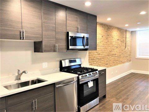 A modern kitchen with a stainless steel dishwasher and oven.