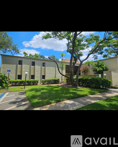 A building with a tree in front of it.