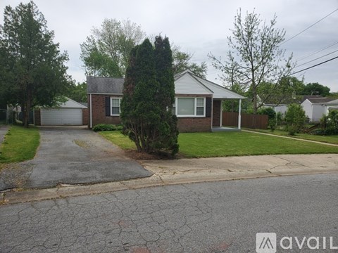 A house with a driveway in front of it.