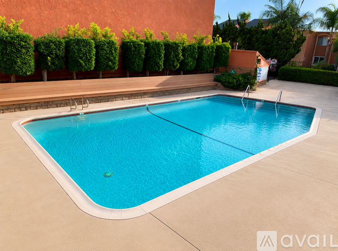 A swimming pool with a blue tinted water.