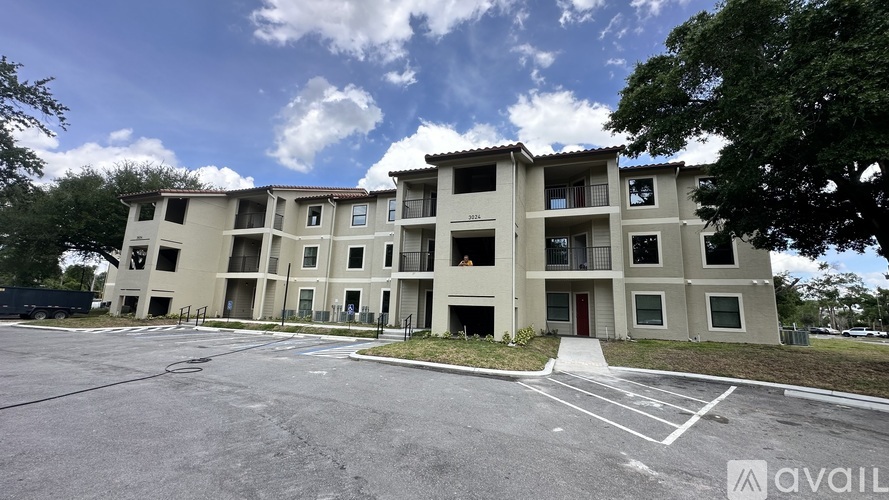 A large apartment complex with multiple buildings and parking spaces.