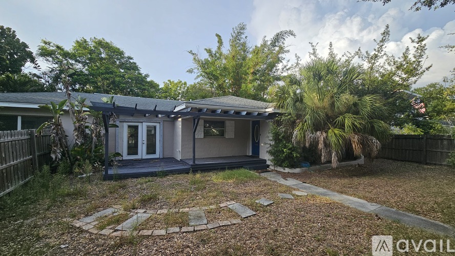 A house with a garden is for sale.