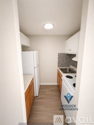 A kitchen with a white fridge and a white dishwasher.