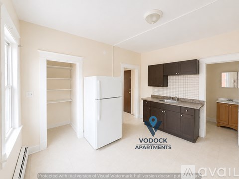 A Vodock Apartments sign is on a kitchen counter.